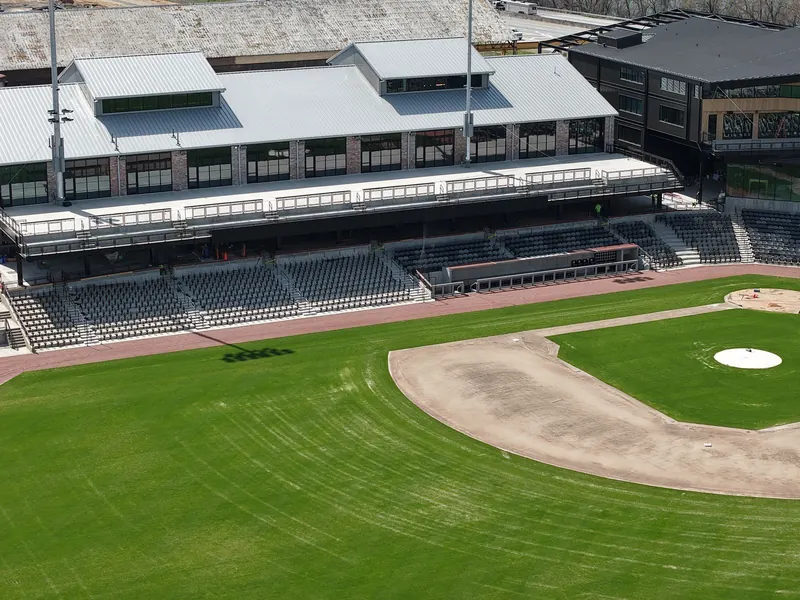 Aerial view of an empty baseball field and grandstand on a sunny day