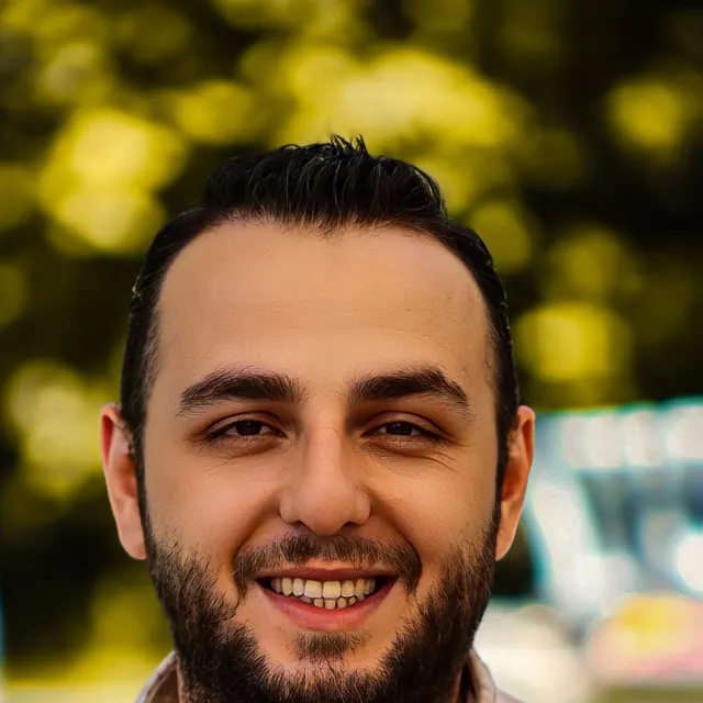 Portrait of a smiling bearded man outdoors